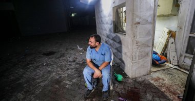 A doctor at the scene of Al-Ahli Baptist Hospital after the Israeli airstrike that killed 500 people, the Gaza Strip, Palestine, Oct. 17, 2023. (EPA Photo)