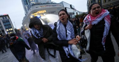 Pro-Palestinian demonstrators walk as police use water canons during a protest in Frankfurt, Germany, Oct. 18, 2023. (Reuters Photo)