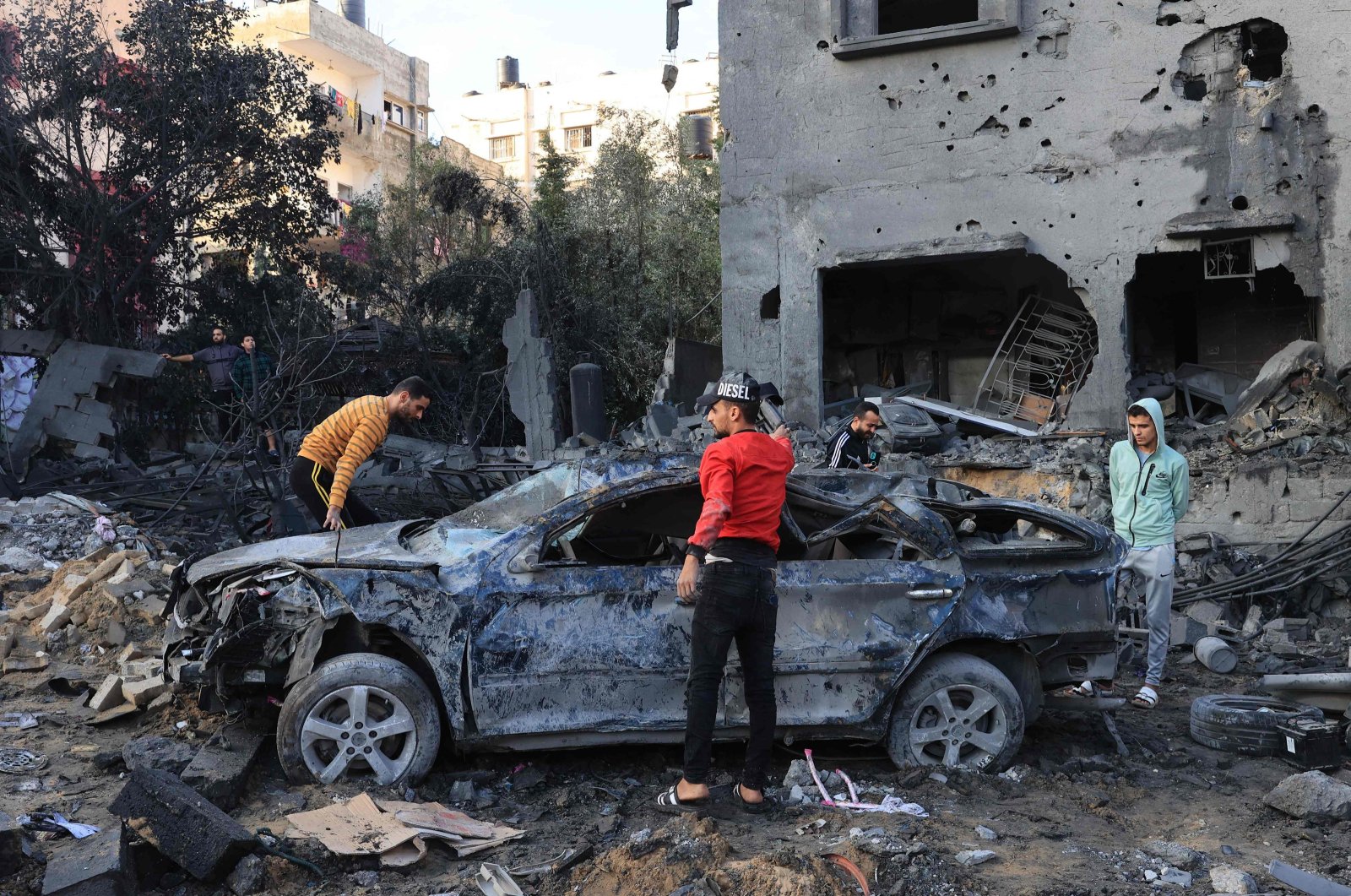 Palestinians inspect the rubble of a building after an Israeli airstrike on the Rafah refugee camp, in the southern Gaza Strip, Palestine, Oct. 17, 2023. (AFP File Photo)