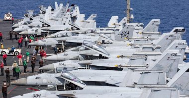 F/A-18 Super Hornets, attached Carrier Air Wing (CVW) 8, prepare for flight operations on the flight deck of the world's largest aircraft carrier USS Gerald R. Ford (CVN) 78 in the Eastern Mediterranean Sea, Oct. 13, 2023. (AFP Photo)