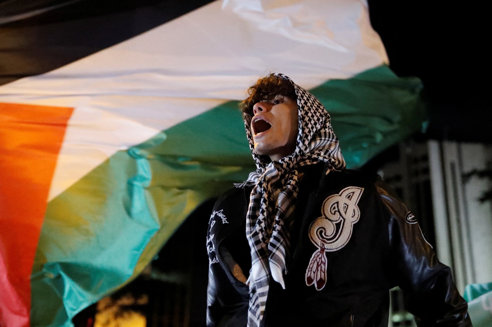 A pro-Palestinian demonstrator shouts slogans during a protest near the Israeli Consulate as the conflict between Israel and Palestine continues, in Istanbul, Türkiye, Oct.18, 2023. (Reuters Photo)