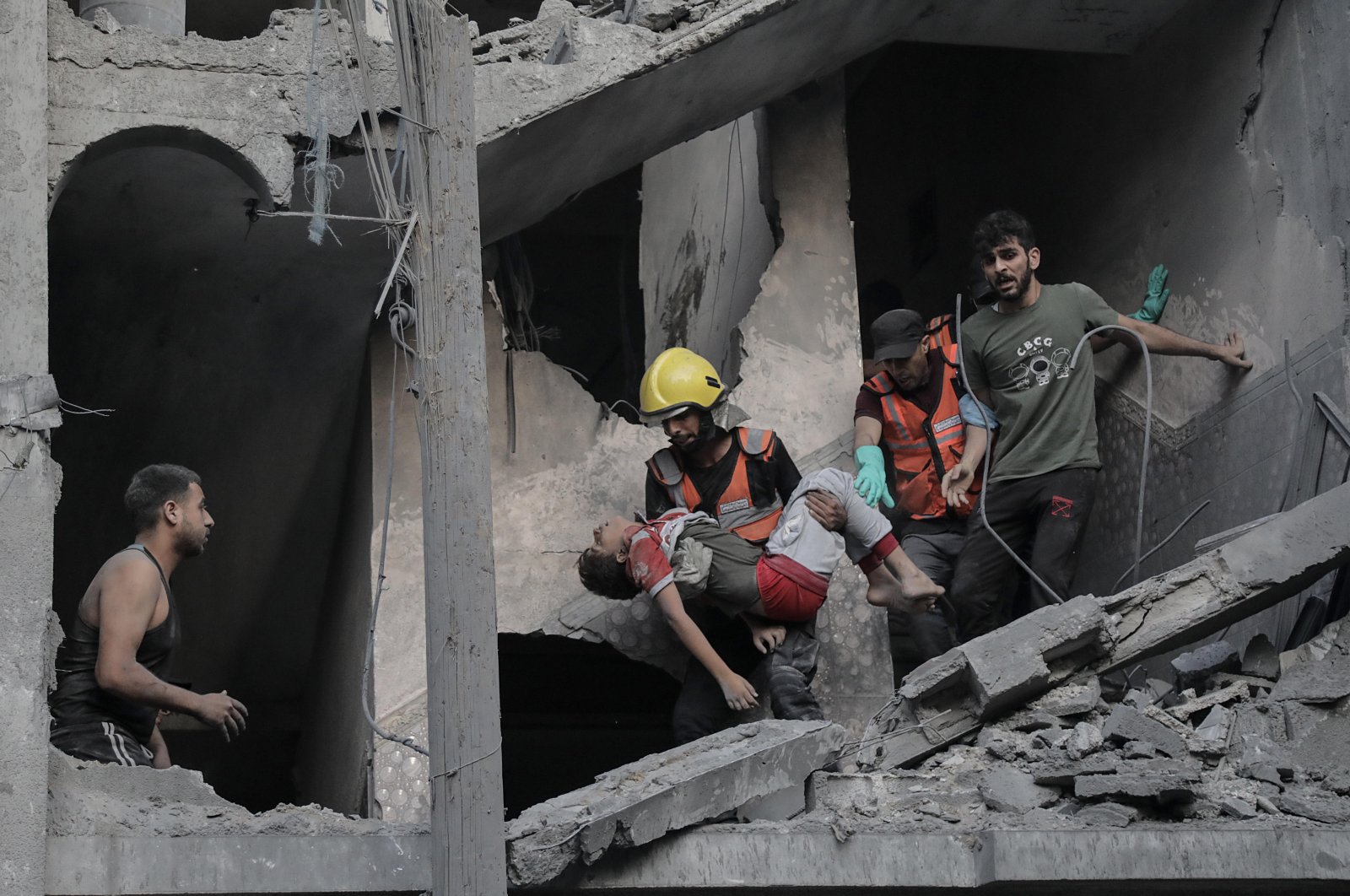 A child is recovered from the rubble of a residential building leveled in an Israeli airstrike, Khan Younis, southern Gaza Strip, Oct. 19, 2023. (EPA Photo)