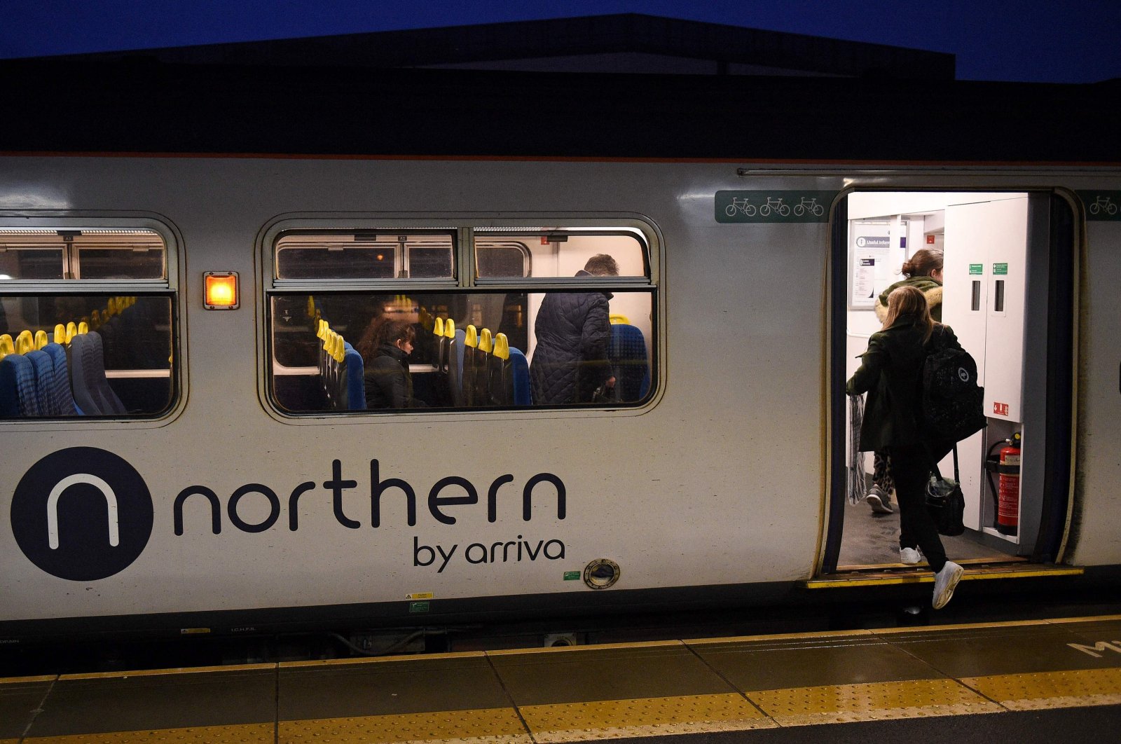 Rail passengers commute on a train, operated by Arriva, a unit of Germany&#039;s Deutsche Bahn, in Ashton-under-Lyne, northern U.K., Jan. 29, 2020. (AFP Photo)