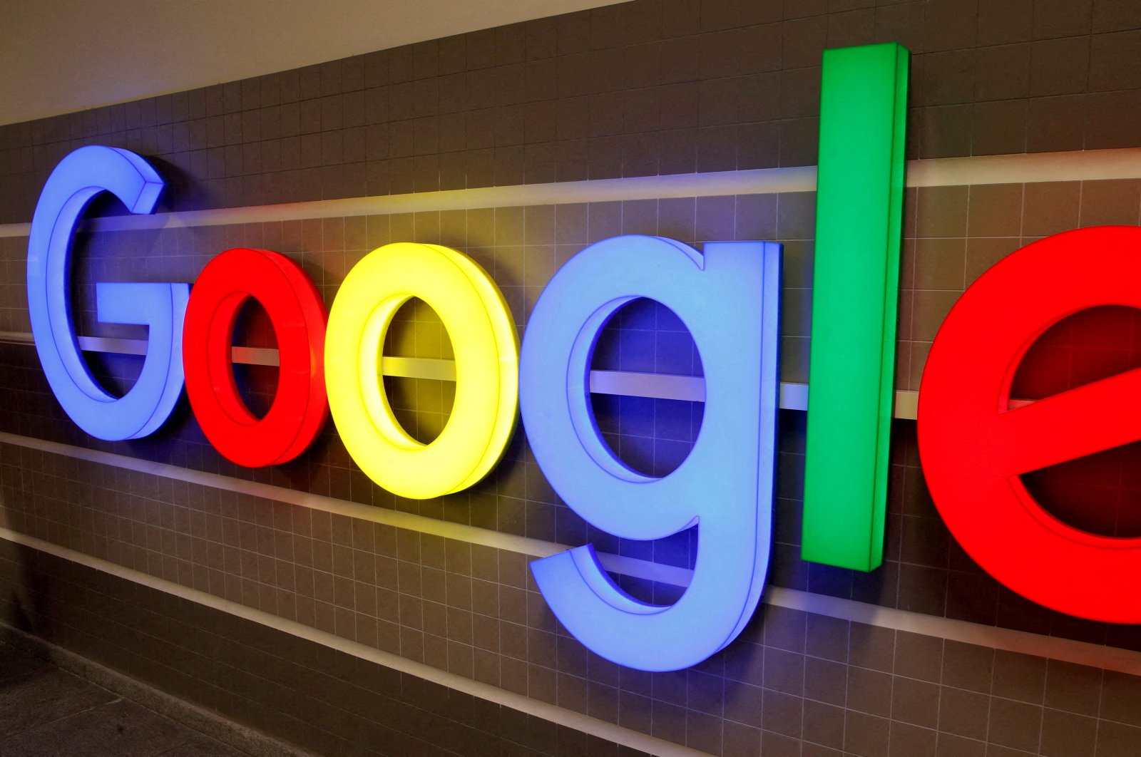 An illuminated Google logo is seen inside an office building in Zurich, Switzerland, Dec. 5, 2018. (Reuters Photo)