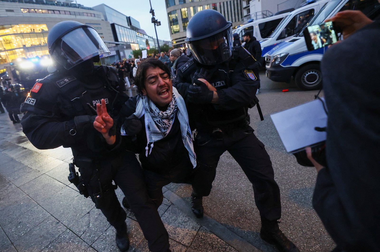 Police officers take away a person during a pro-Palestinian demonstration, in Frankfurt, Germany, Oct. 18, 2023. (Reuters Photo)
