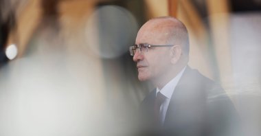 Treasury and Finance Minister Mehmet Şimşek attends an interview during the annual meeting of the International Monetary Fund and the World Bank, in Marrakech, Morocco, Oct. 13, 2023. (Reuters Photo)