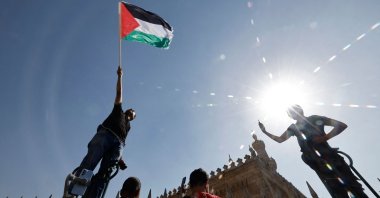 A man waves the Palestinian flag during a protest supporting the Palestinian people in Cairo, Egypt, Oct. 20, 2023 (AFP Photo)