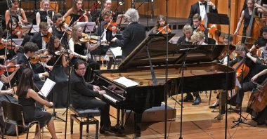 Orchestra accompanies Turkish pianist Fazıl Say on the piano, Sept. 25, 2021. (Reuters File Photo)