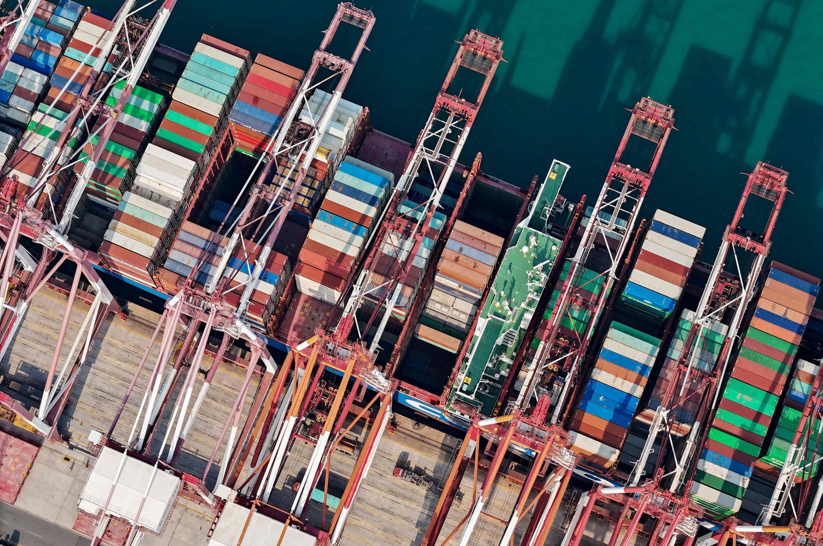 This aerial photo shows cranes and shipping containers at Qingdao port in China&#039;s eastern Shandong province, Oct. 13, 2023. (AFP Photo)