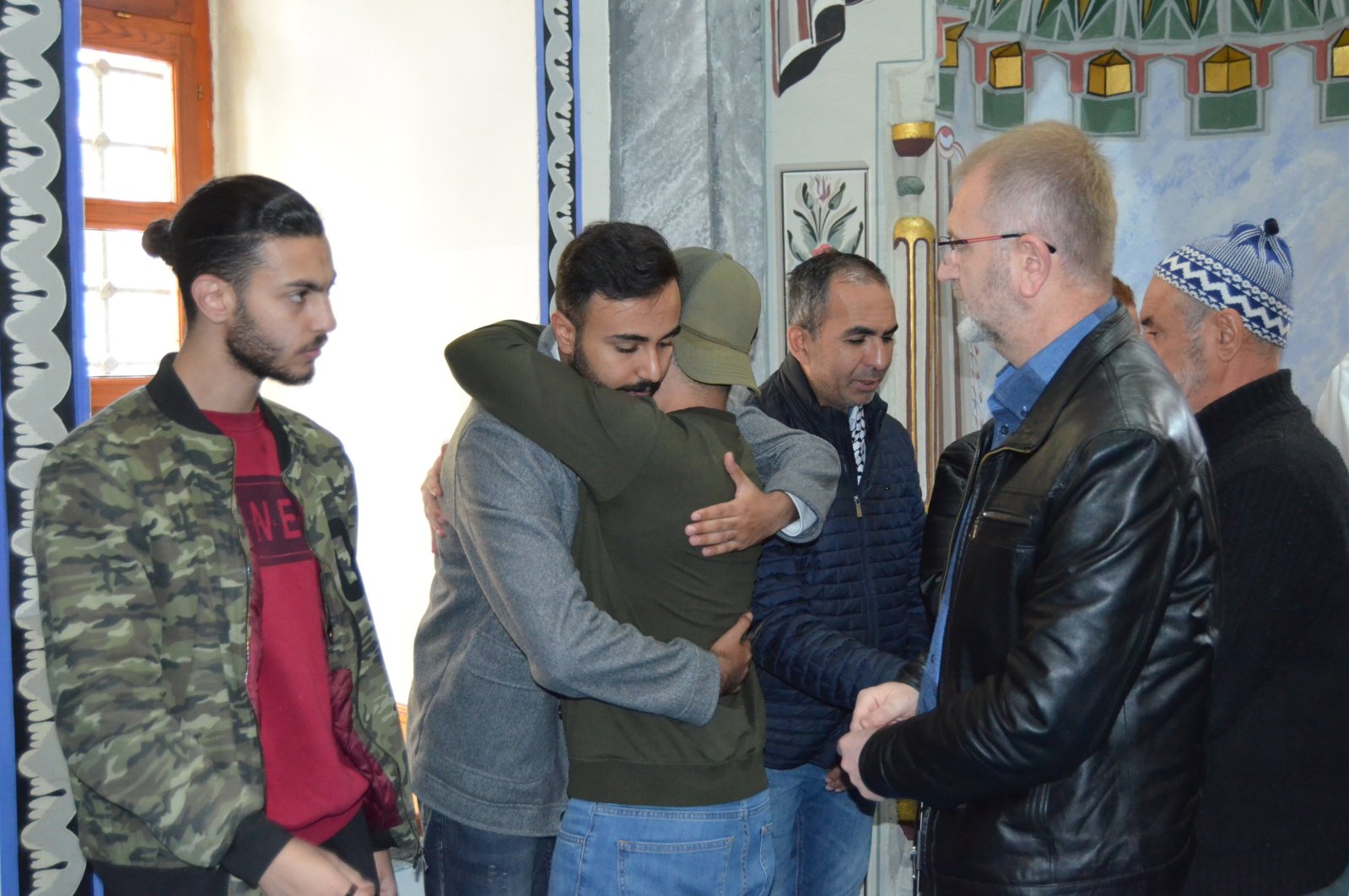 People hug Palestinian student Abdullah Abu Jassir after a funeral prayer in absentia for Palestinians, Kütahya, western Türkiye, Oct. 19, 2023. (AA Photo)