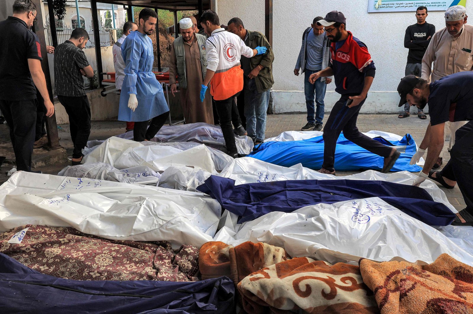 The covered bodies of Palestinians killed in an Israeli airstrike, at a hospital in Rafah in the southern Gaza Strip, Palestine, Oct. 19, 2023. (AFP Photo)