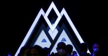 People pass by a Web Summit logo during Web Summit, Europe&#039;s largest technology conference, in Lisbon, Portugal, Nov. 3, 2021. (Reuters File Photo)