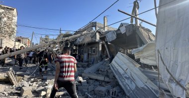 Palestinians look for survivors after Israeli airstrike on Nusseirat Refugee Camp in Gaza, Friday, Oct. 20, 2023. (AA Photo)
