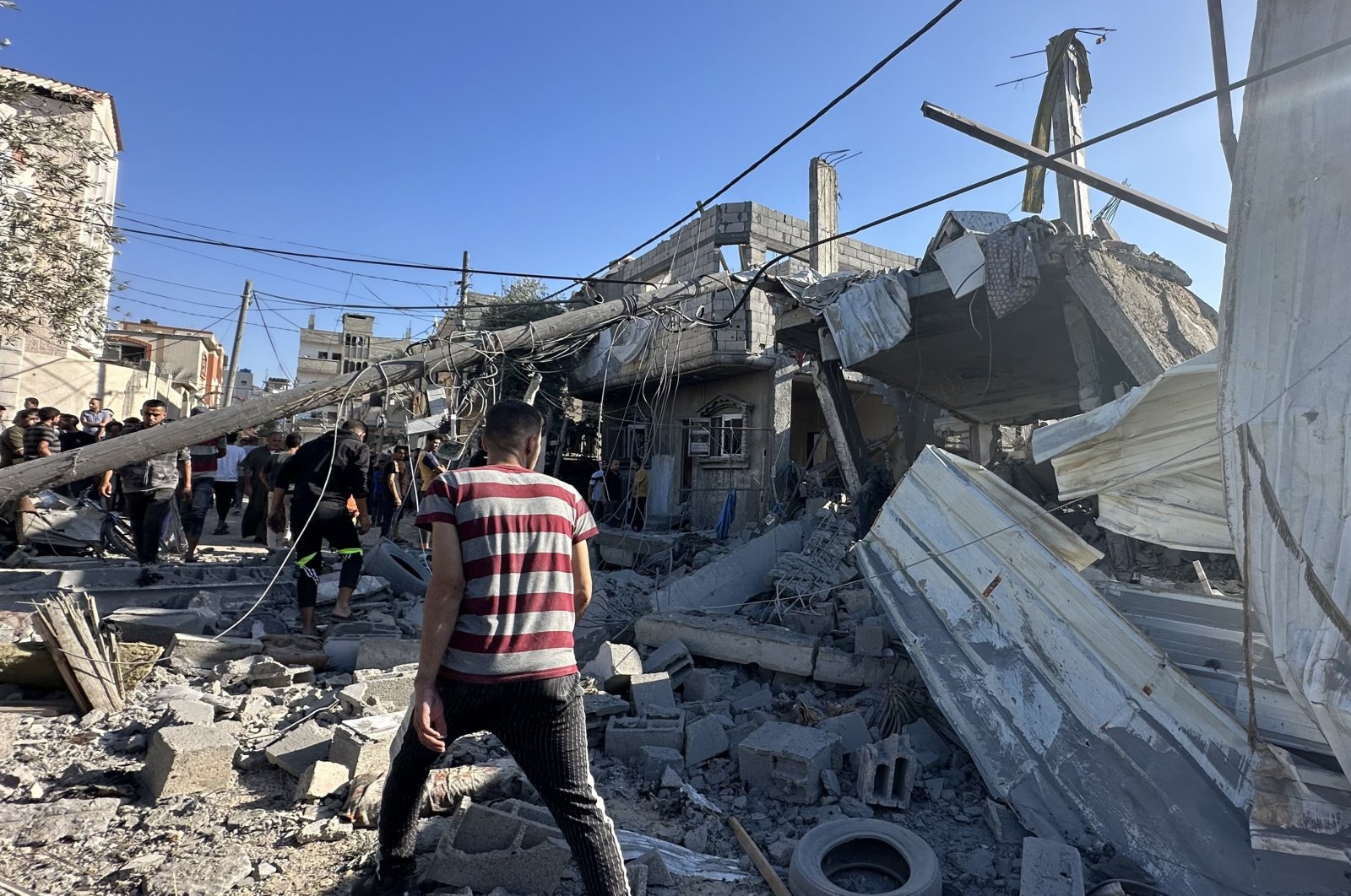 Palestinians look for survivors after Israeli airstrike on Nusseirat Refugee Camp in Gaza, Friday, Oct. 20, 2023. (AA Photo)
