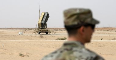 In this file photo, a member of the U.S. Air Force stands near a Patriot missile battery in al-Kharj, Saudi Arabia, Feb. 20, 2020. (AP Photo)