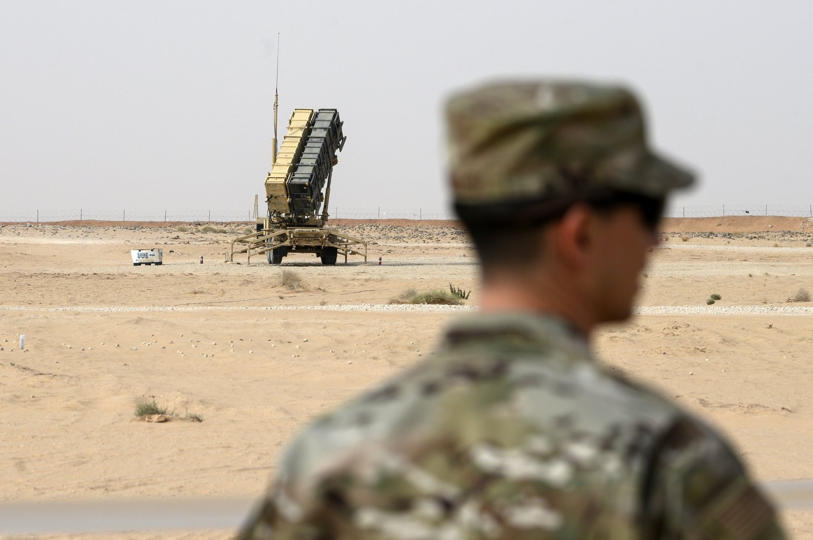 In this file photo, a member of the U.S. Air Force stands near a Patriot missile battery in al-Kharj, Saudi Arabia, Feb. 20, 2020. (AP Photo)