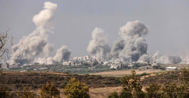 A picture taken from the southern Israeli city of Sderot shows smoke and debris ascending over the northern Gaza Strip following an Israeli strike, Oct. 23, 2023. (AFP Photo)