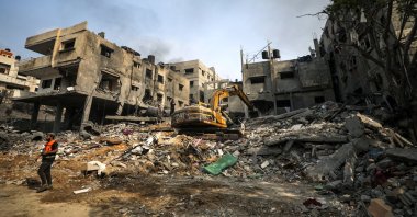 Palestinian civil defense workers search for victims and survivors among the rubble of a destroyed family house following an Israeli airstrike in Gaza City, Palestine, Oct. 23, 2023. (EPA Photo)