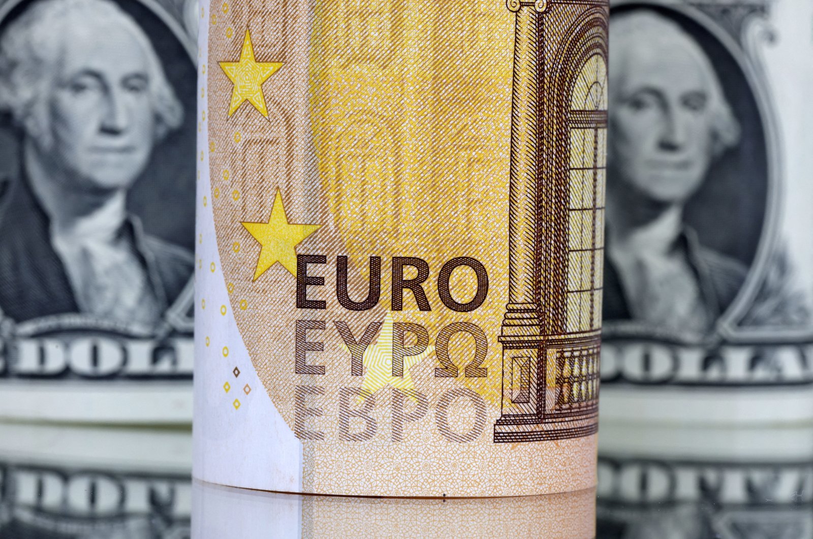 U.S. dollar and euro banknotes are seen in this illustration taken July 17, 2022. (Reuters Photo)