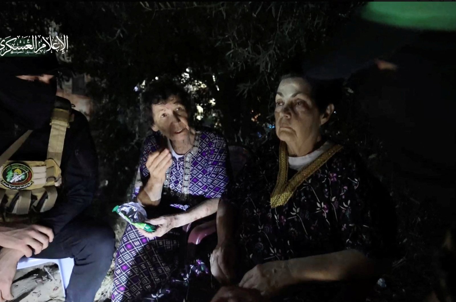 Yocheved Lifshitz and Nurit Cooper (also known as Nurit Yitzhak) who were held hostages by Hamas, are seen in this video screengrab obtained by Reuters on Oct. 23, 2023.  (Al-Qassam Brigades, military wing of Hamas/Handout via Reuters)
