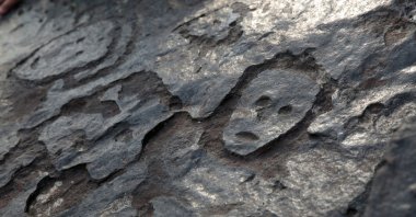 A view of ancient stone carvings on a rocky point of the Amazon river that were exposed after water levels dropped to record lows during a drought in Manaus, Amazonas state, Brazil, Oct. 23, 2023. (Reuters Photo)