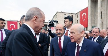 President Recep Tayyip Erdoğan shakes hands with MHP leader Devlet Bahçeli outside Parliament, in the capital Ankara, Türkiye, Oct. 1, 2023. (AA Photo)