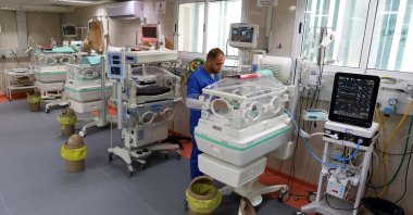 A medical worker assists a premature Palestinian baby who lies in an incubator at the maternity ward of Shifa Hospital, in Gaza City, Palestine, Oct. 22, 2023. (Reuters Photo)