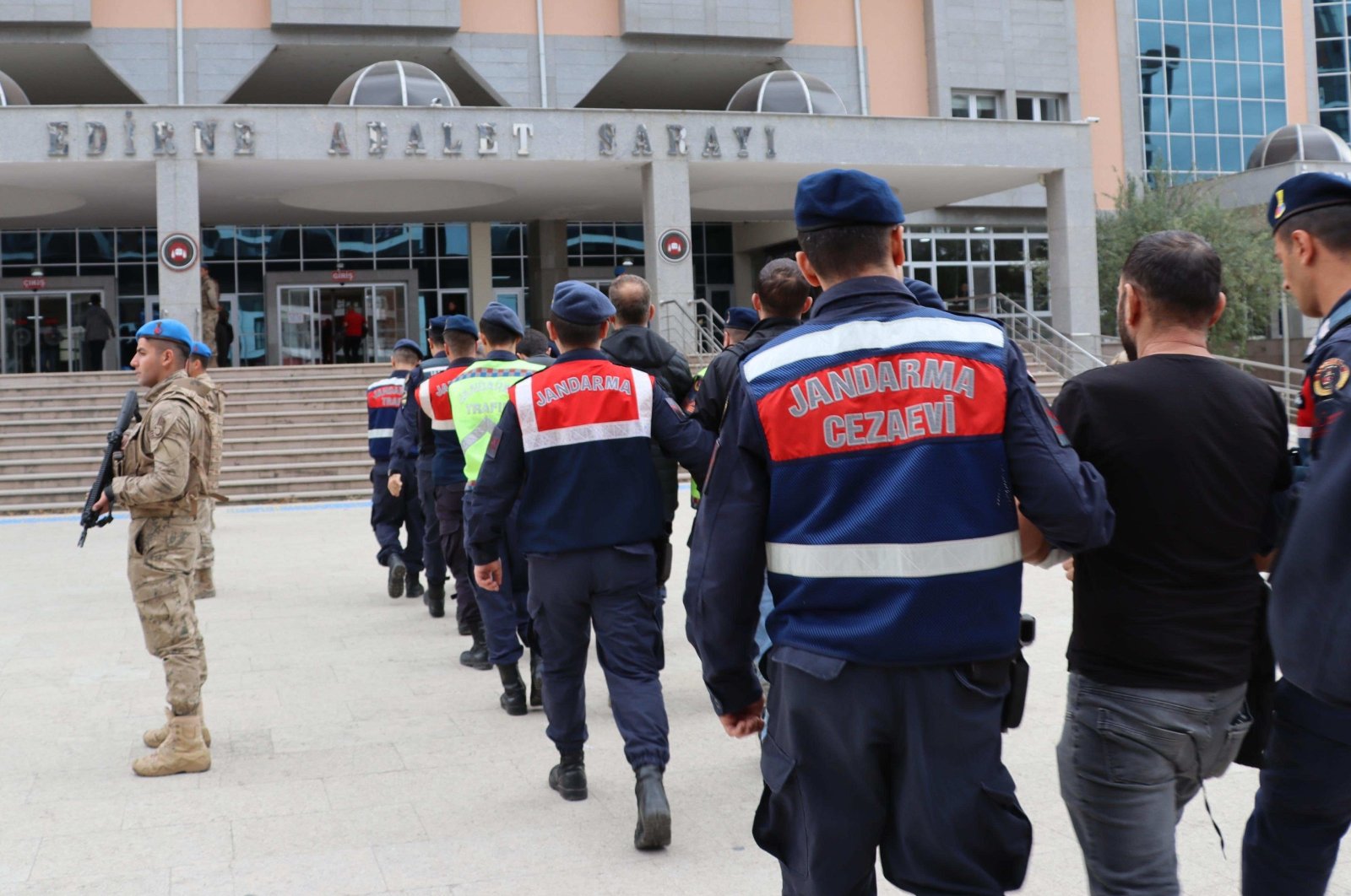 Gendarmerie officers escort six suspects linked to the Gülenist Terror Group (FETÖ) to the courthouse in the northwestern Edirne province, Türkiye, Oct. 24, 2023. (AA Photo)