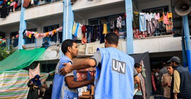 Workers of the UNRWA are seen at the playground of a school in Khan Yunis, southern Gaza Strip, Palestine, Oct. 25, 2023. (AFP Photo)