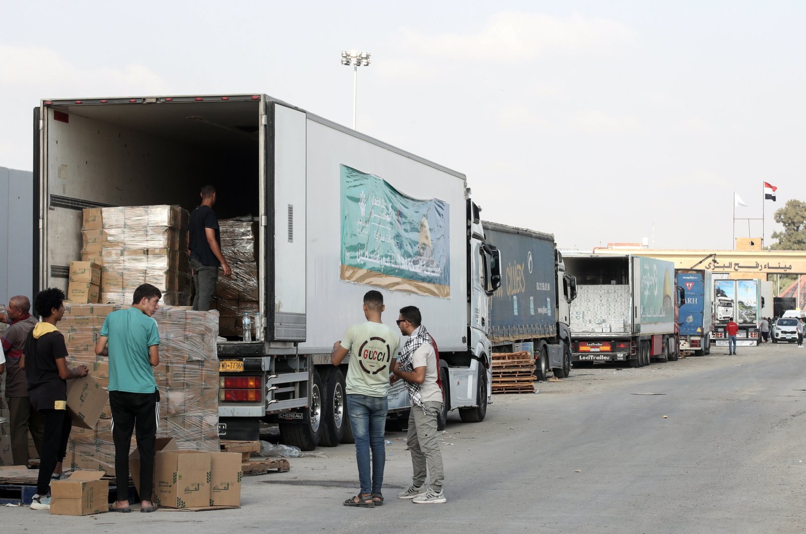 The humanitarian aid convoy bound for the Gaza Strip is seen parked outside Rafah border gate, at the Rafah border crossing, Egypt, Oct. 24, 2023. (EPA Photo)