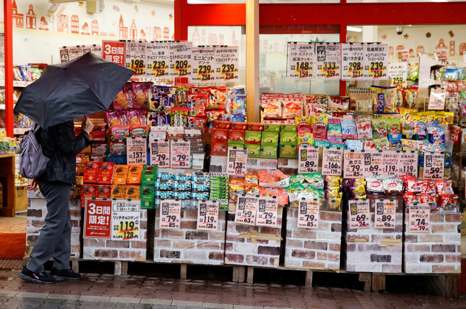 A woman looks at items at a shop in Tokyo, Japan, March 24, 2023. (Reuters Photo)