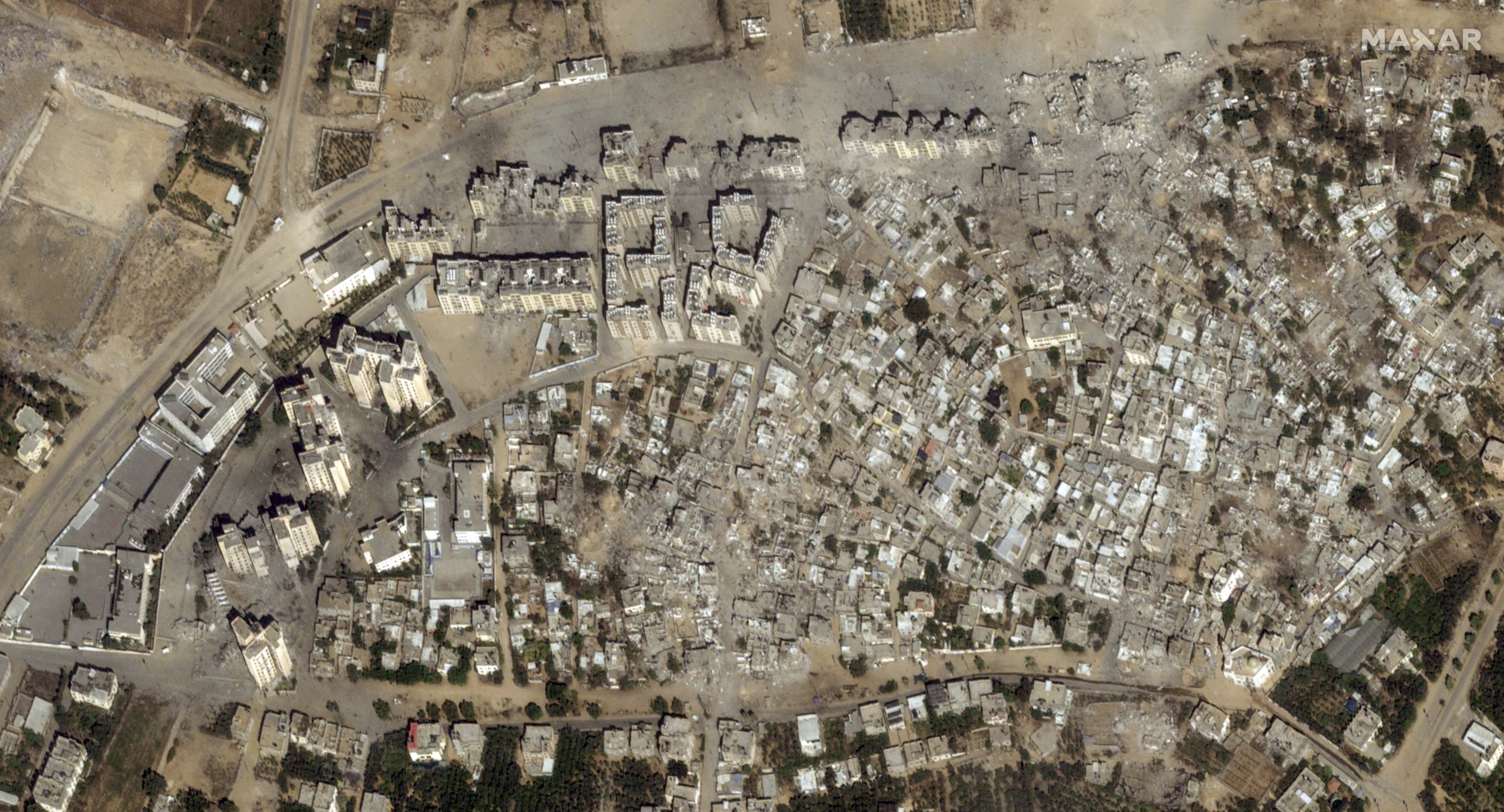 This image provided by Maxar Technologies shows after bombing damage in the Izbat Beit Hanoun neighborhood, in northern Gaza, Oct. 21, 2023. (Satellite image ©2023 Maxar Technologies via AP)