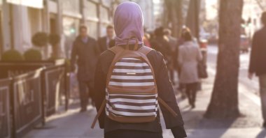 The woman narrowly avoided an assault when the hooded man threw a construction slab at her. (Reuters Stock Photo)