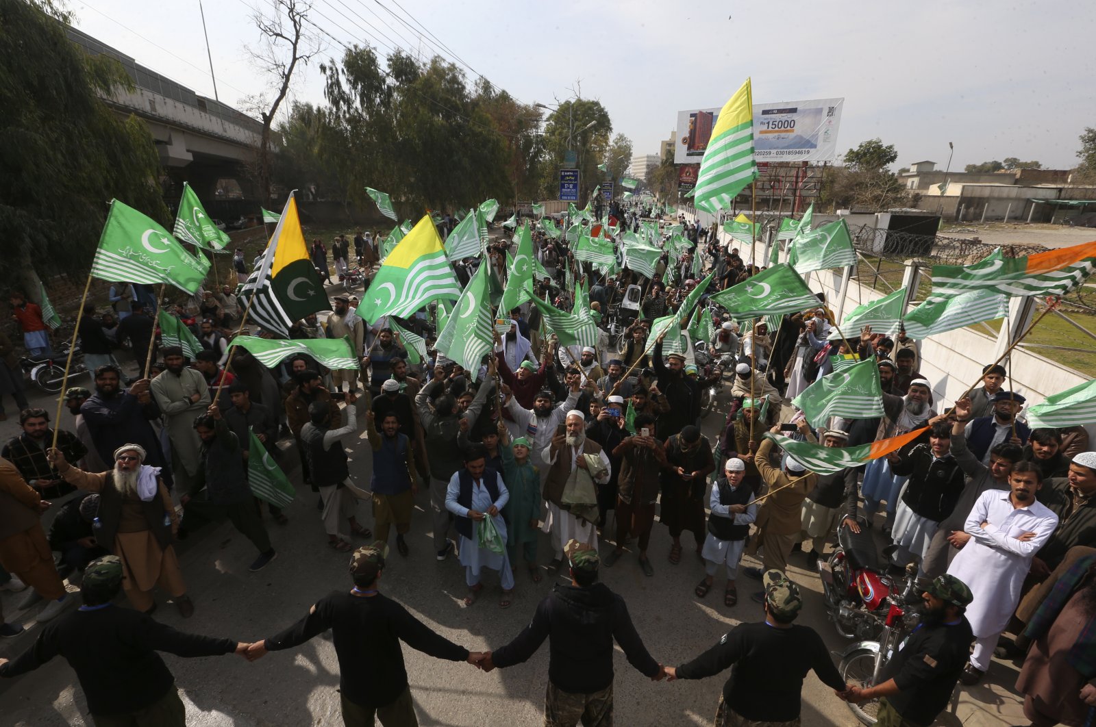Supporters of the Pakistan Markazi Muslim League Party participate in a rally to mark Kashmir Solidarity Day, Peshawar, Pakistan, Feb. 5, 2023. (AP Photo)