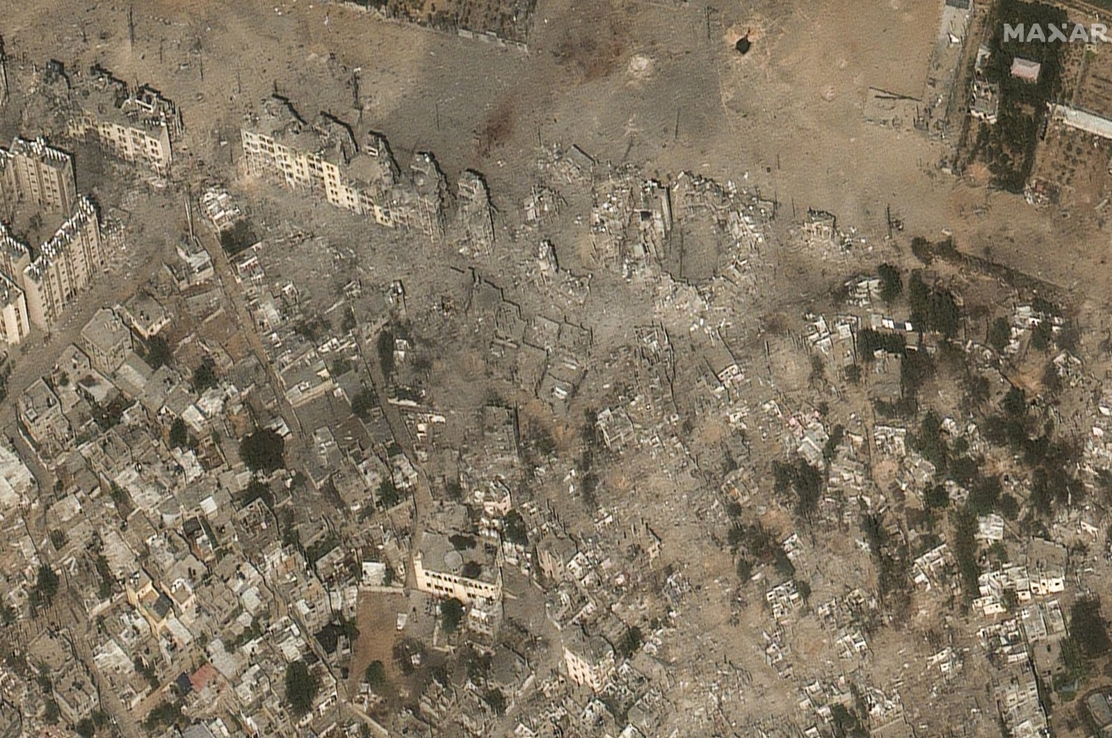 This image provided by Maxar Technologies shows closer to the damage of buildings and structures after Israeli airstrikes in the Izbat Beit Hanoun neighborhood, in northern Gaza, Oct. 21, 2023. (Satellite image ©2023 Maxar Technologies via AP)