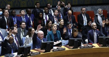 Russian representative to the United Nations Vassily Nebenzia and Pascale Baeriswyl, Permanent Representative of Switzerland to the U.N. vote during the Security Council meeting on the status of the Palestinians and the current situation in the Middle East at the United Nations Headquarters, NewYork, Oct.18, 2023. (Getty Images Photo)