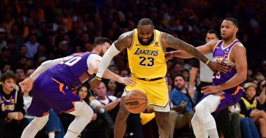 Los Angeles Lakers forward LeBron James (23) moves in for the ball against Phoenix Suns center Jusuf Nurkic (20) and guard Eric Gordon (23) during the second half at Crypto.com Arena, Los Angeles, California, U.S., Oct. 26, 2023. (Reuters Photo)
