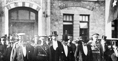 President Mustafa Kemal Atatürk (C) leaves Parliament to attend Republic Day celebrations, in the capital Ankara, Türkiye, Oct. 30, 1930. (AA Photo)