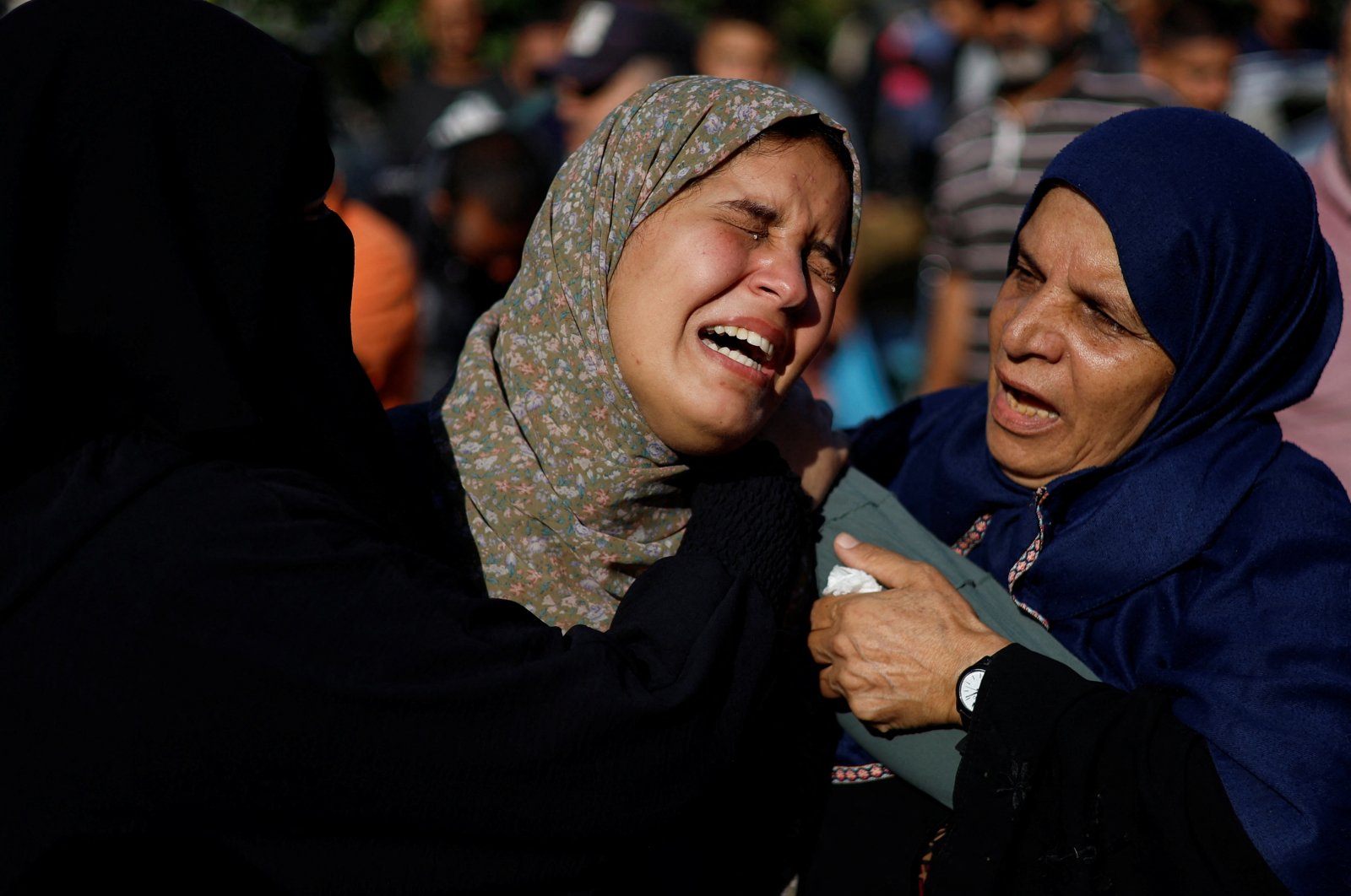 Women mourn during a funeral for Palestinians killed by Israeli strikes, as the conflict between Israel and Palestinian Islamist group Hamas continues, in Khan Younis in the southern Gaza Strip, Oct. 26, 2023. (Reuters Photo)