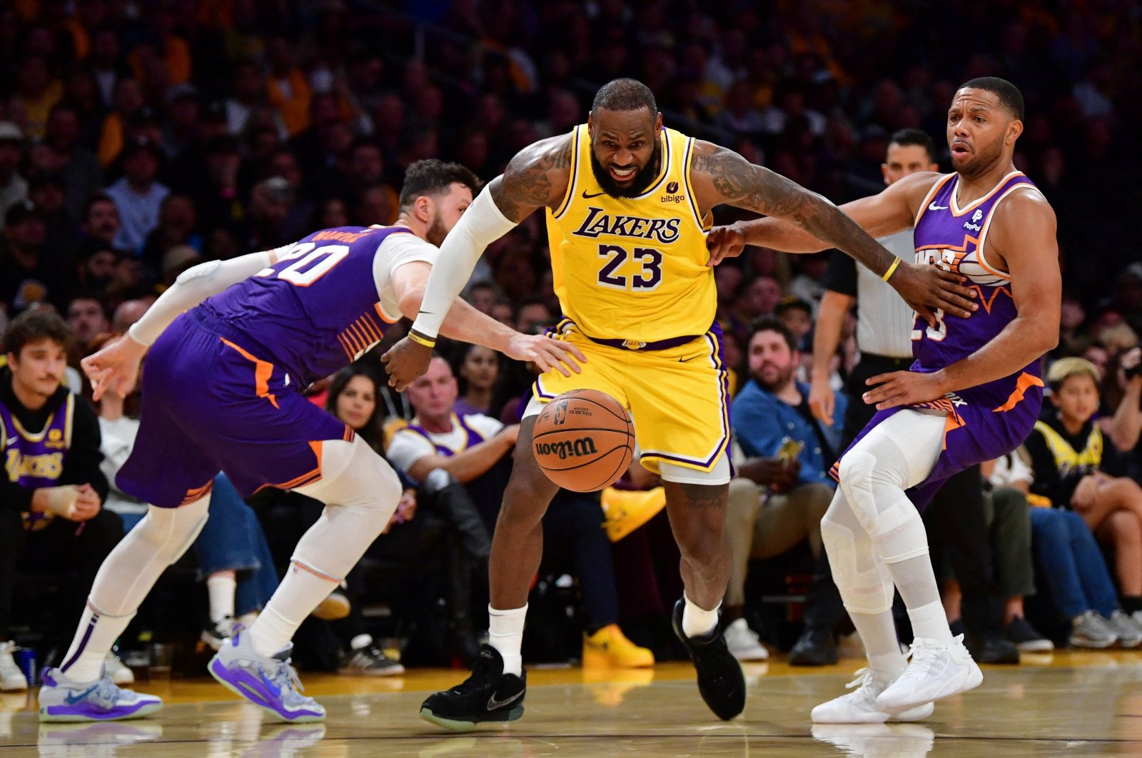 Los Angeles Lakers forward LeBron James (23) moves in for the ball against Phoenix Suns center Jusuf Nurkic (20) and guard Eric Gordon (23) during the second half at Crypto.com Arena, Los Angeles, California, U.S., Oct. 26, 2023. (Reuters Photo)