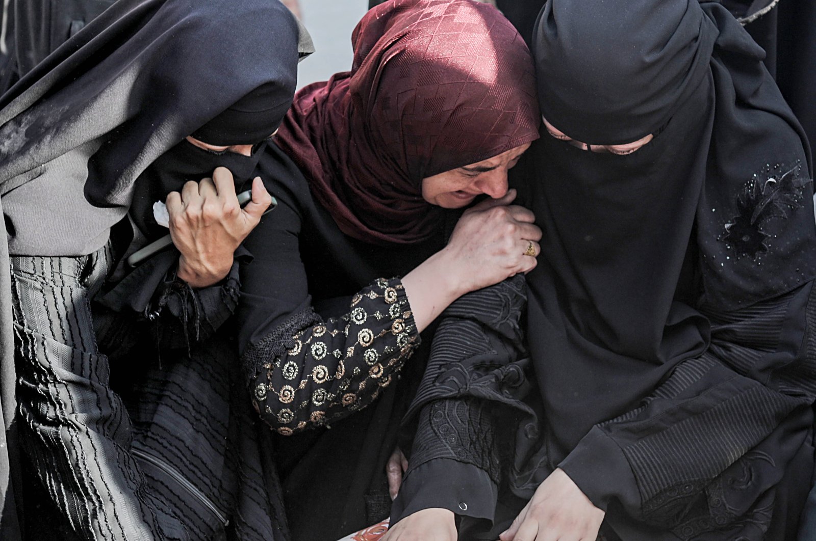 Relatives of Palestinians killed by Israeli strikes mourn next to their bodies at the Nasser Hospital in Khan Yunis, southern Gaza Strip, Palestine, Oct. 27, 2023. (EPA)