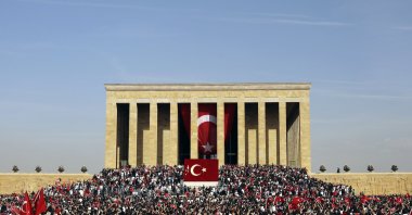 People gather outside Anıtkabir, the mausoleum of Mustafa Kemal Atatürk, watching the Turkish air force show as part of celebrations marking the 100th anniversary of the republic, in the capital Ankara, Türkiye, Oct. 29, 2023. (AP Photo)