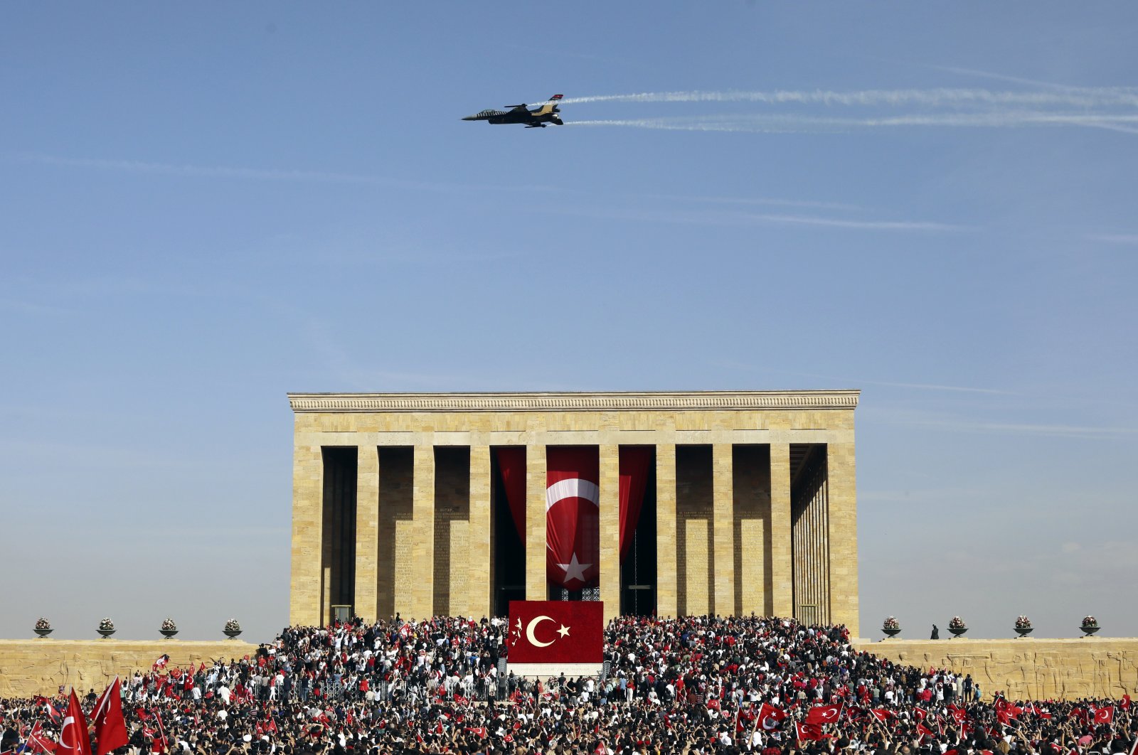 People gather outside Anıtkabir, the mausoleum of Mustafa Kemal Atatürk, watching the Turkish air force show as part of celebrations marking the 100th anniversary of the republic, in the capital Ankara, Türkiye, Oct. 29, 2023. (AP Photo)