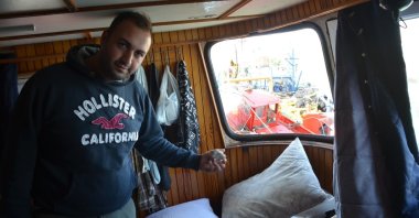 Ali Sarıhan shows smashed windows and a rock thrown at his boat by the Greek coast guard in the captain’s cabin, in western Aydın province, Türkiye, Oct. 30, 2023. (IHA Photo)