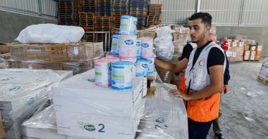 A Red Crescent worker sorts aid before being distributed to Palestinians, in Khan Younis in the southern Gaza Strip, Oct. 23, 2023. (Reuters File Photo)