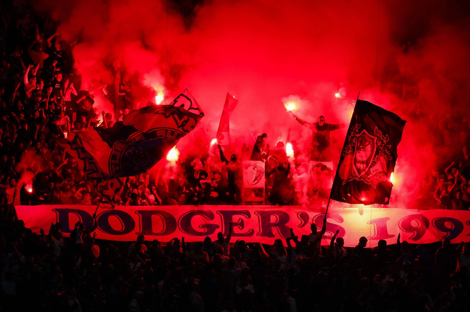 Marseille&#039;s supporters burn flares during the UEFA Europa League Group B football match between Olympique Marseille and AEK Athens at Stade Velodrome in Marseille, southern France, Oct. 26, 2023. (AFP Photo)