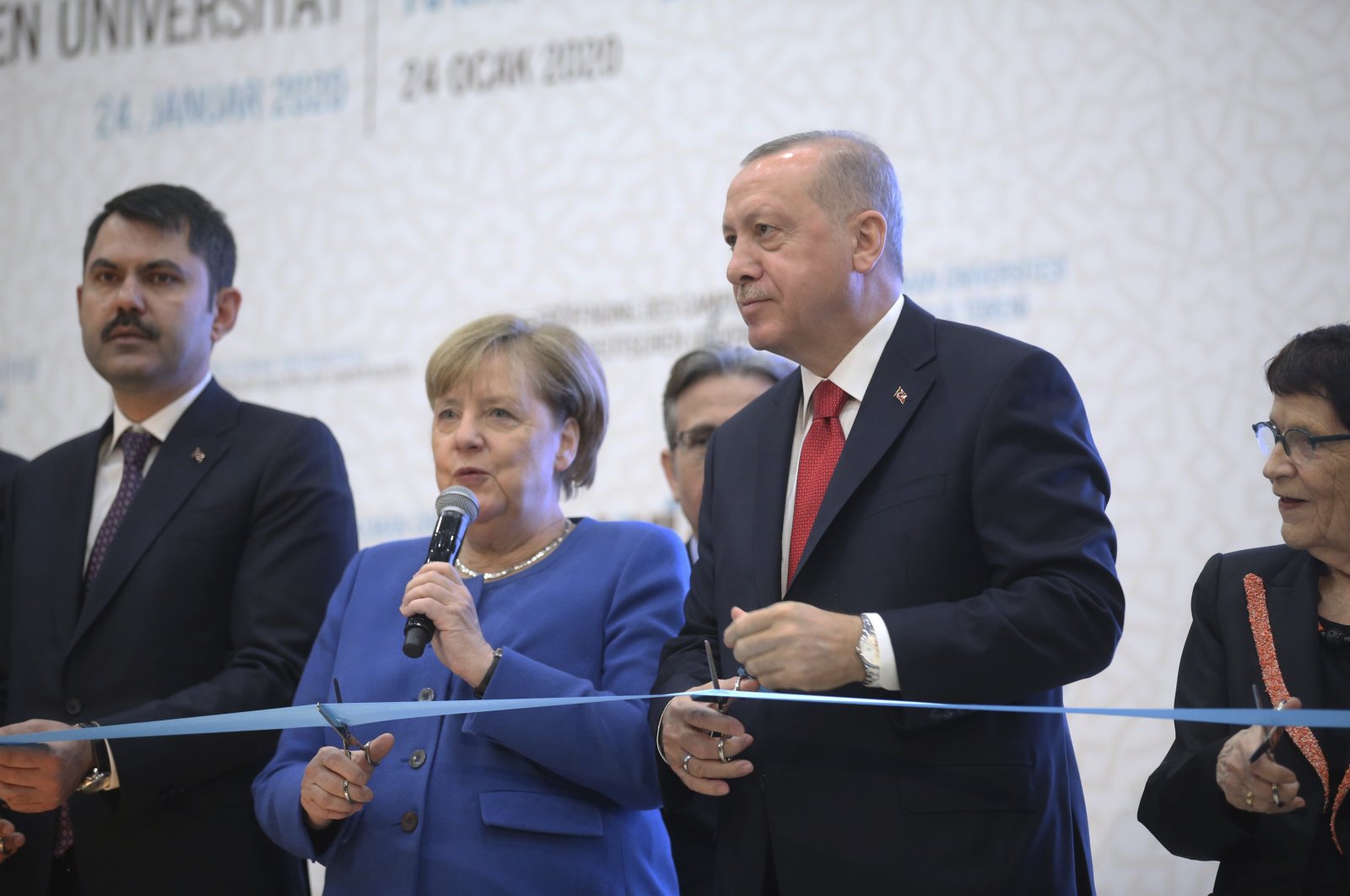 German Chancellor Angela Merkel (C), accompanied by President Recep Tayyip Erdoğan, speaks during the opening ceremony of Turkish-German University&#039;s new campus, Istanbul, Türkiye, Jan. 24, 2020. (AP Photo)