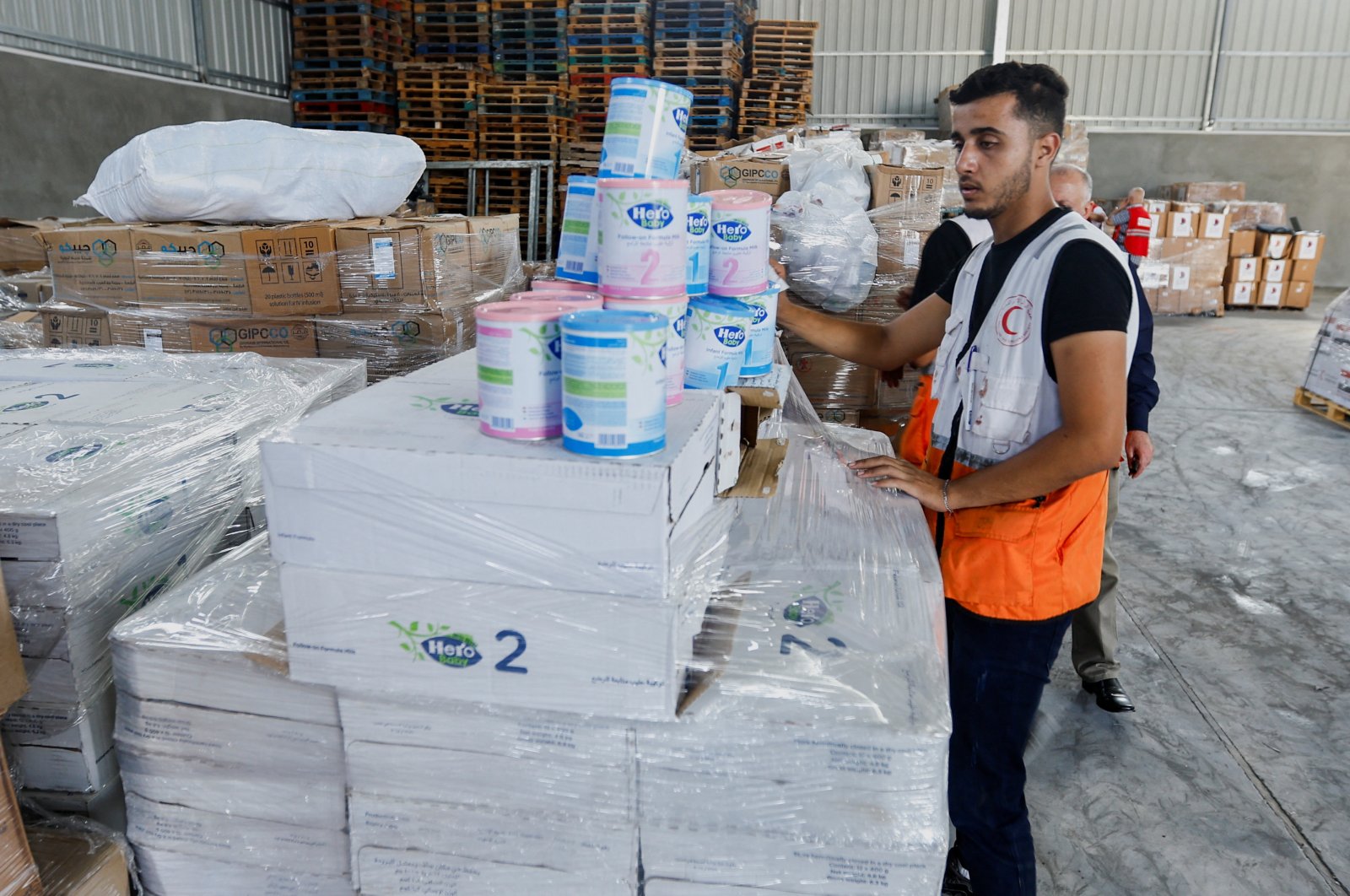 A Red Crescent worker sorts aid before being distributed to Palestinians, in Khan Younis in the southern Gaza Strip, Oct. 23, 2023. (Reuters File Photo)
