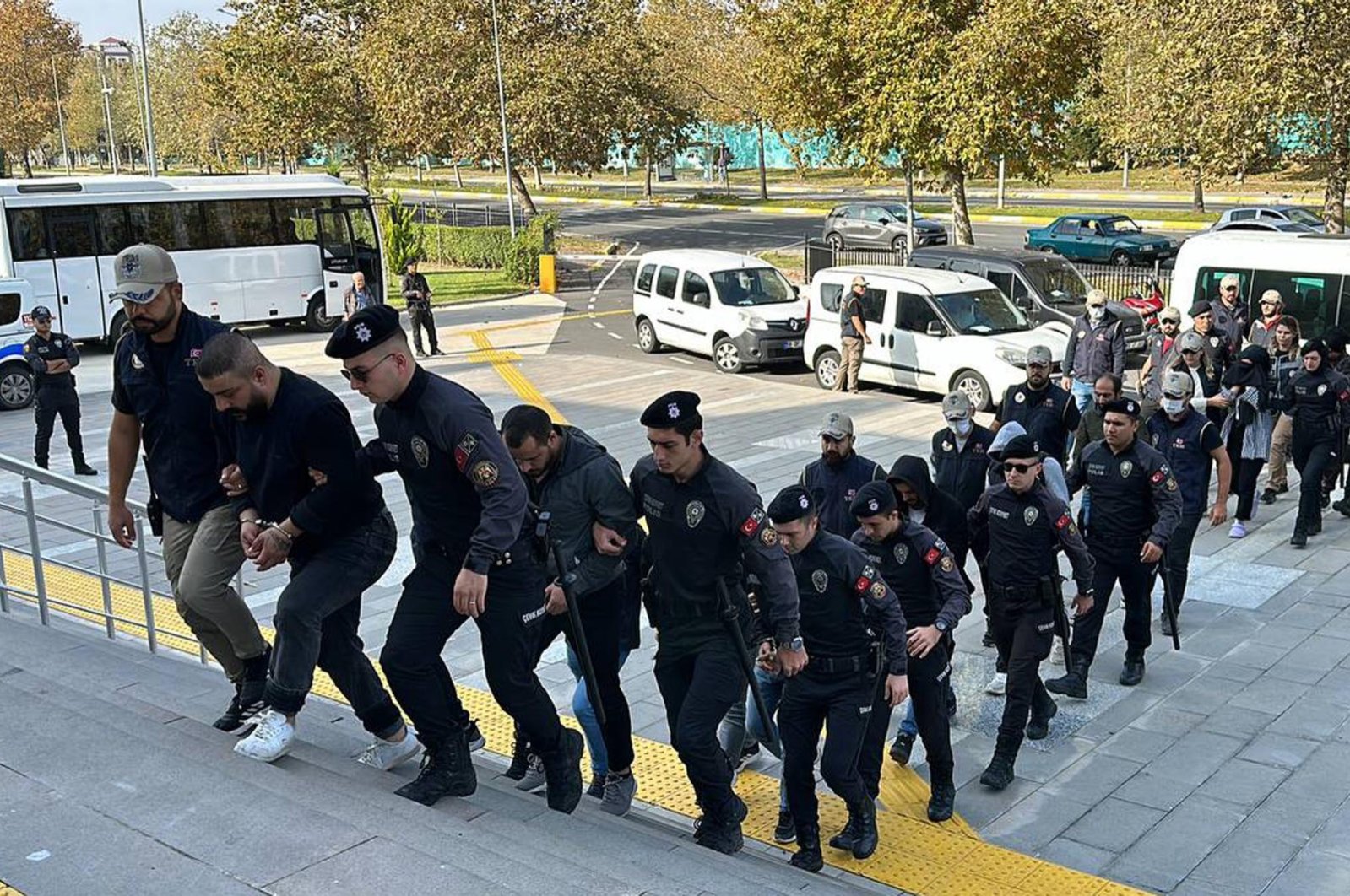 Turkish police escort nine PKK suspects to the courthouse in northwestern Tekirdağ province, Türkiye, Oct. 24, 2023. (DHA Photo)