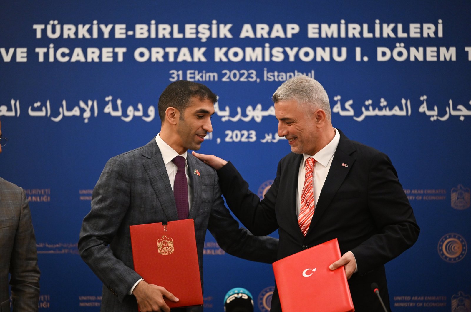 Trade Minister Ömer Bolat (R) and his Emirati counterpart Thani bin Ahmed Al Zeyoudi after singing an agreement during the Türkiye-UAE Joint Economic and Trade Committee (JETCO) 1st Term Meeting, in Istanbul, Türkiye, Oct. 31, 2023. (AA Photo)